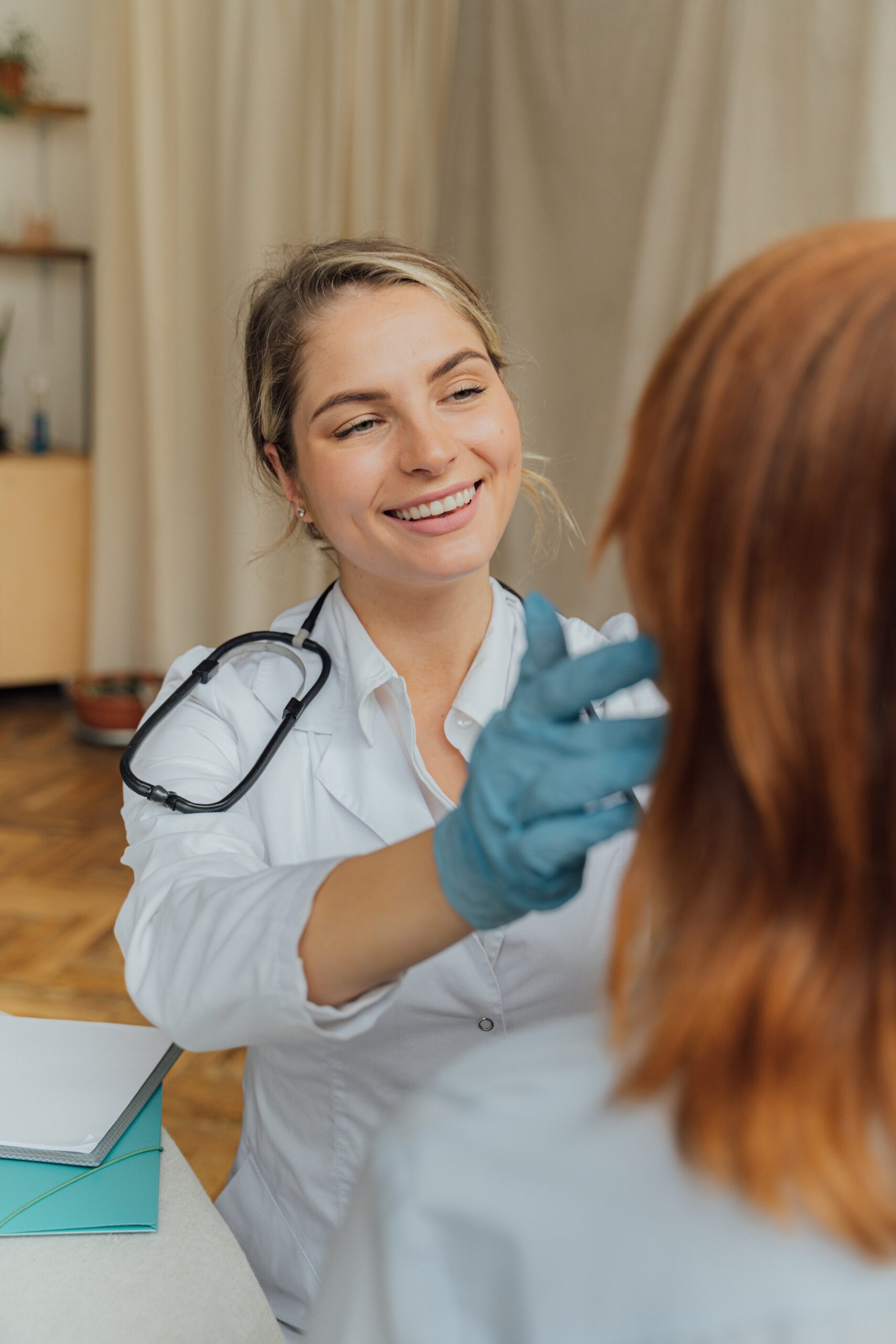 A female doctor examining a patient