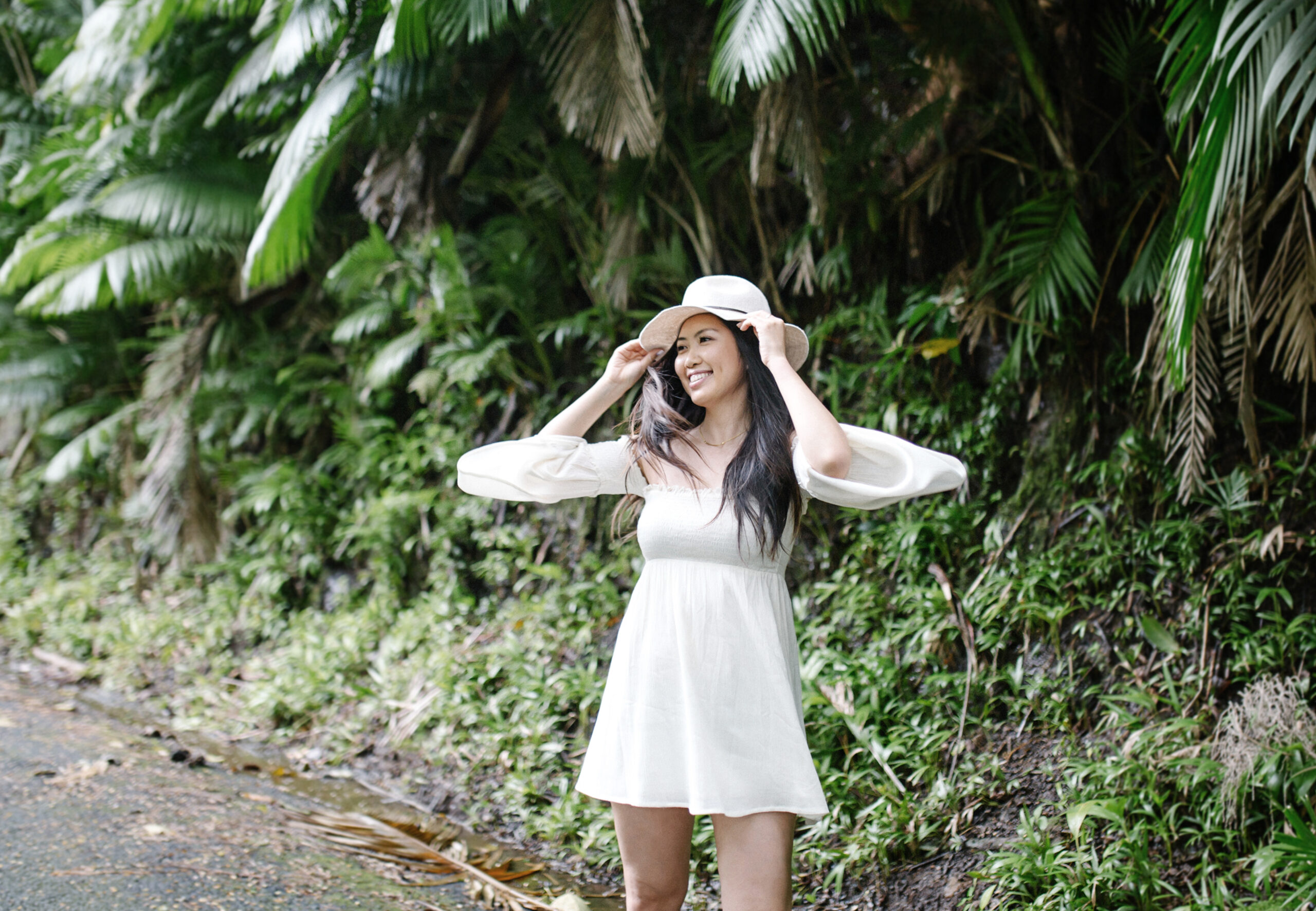 Asian woman smiling and beaming with confidence in nature